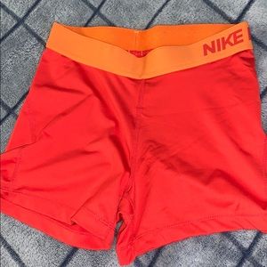 Orange Nike pros